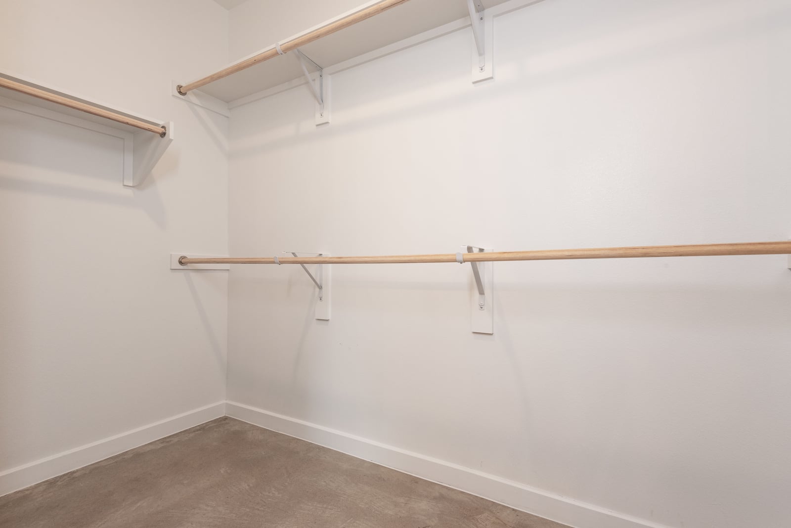 The Artesian at Bee Cave walk-in closet with double hanging rods