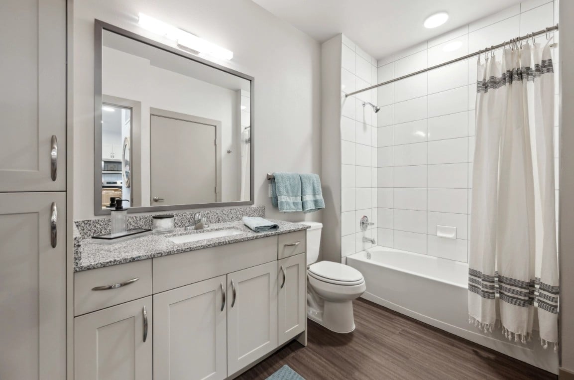 Berry model bathroom with granite vanity and tub shower