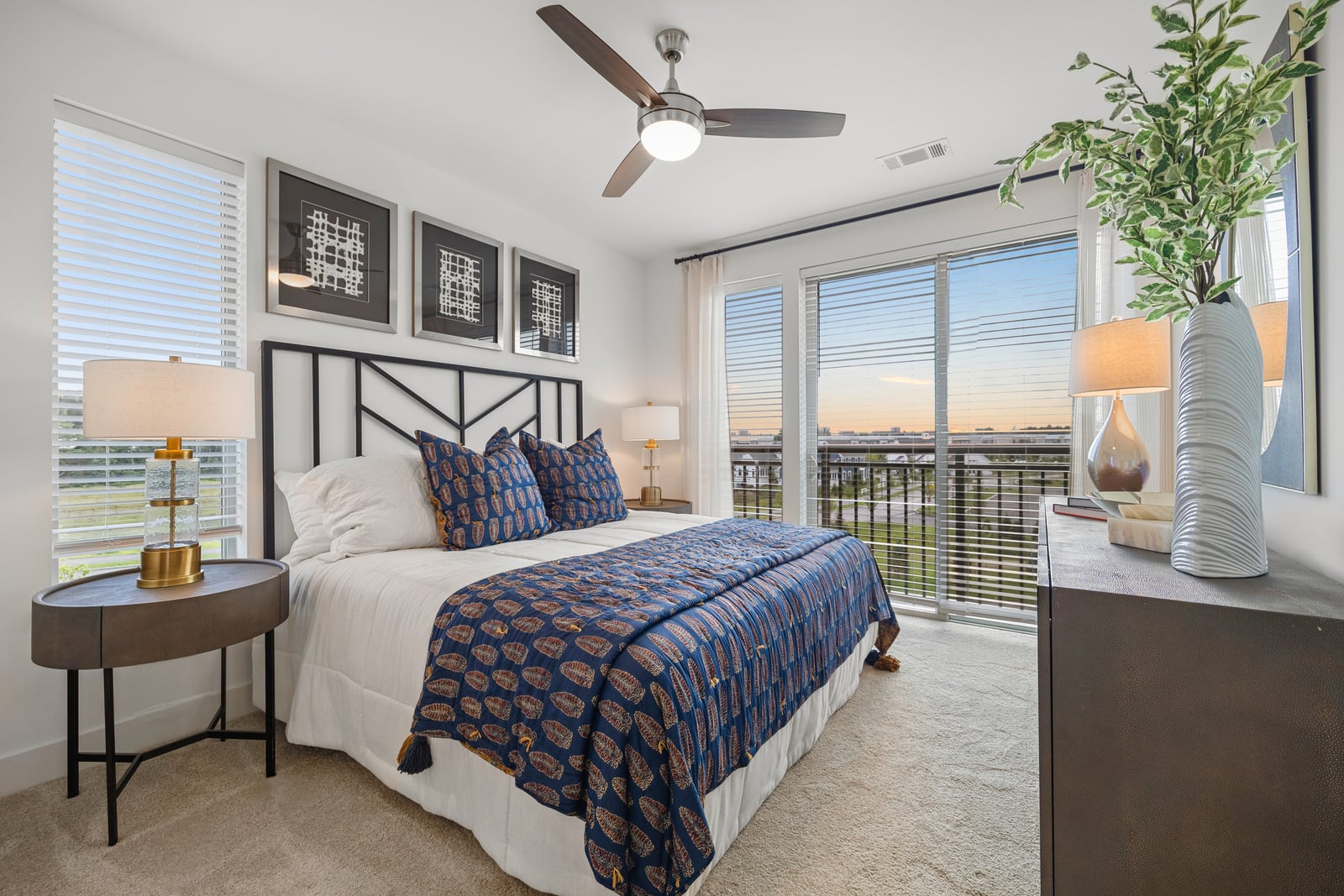 Colony Place bedroom with floor-to-ceiling windows and king bed