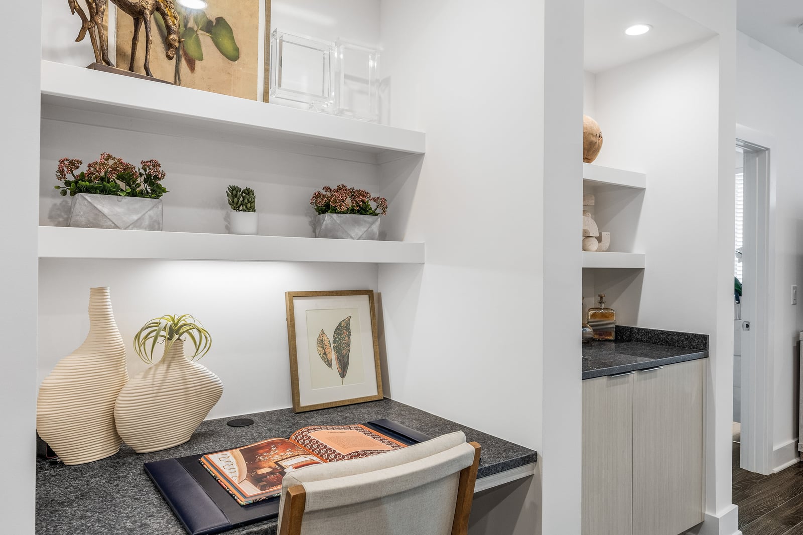 Edgewood built-in office nook with floating shelves and granite desk