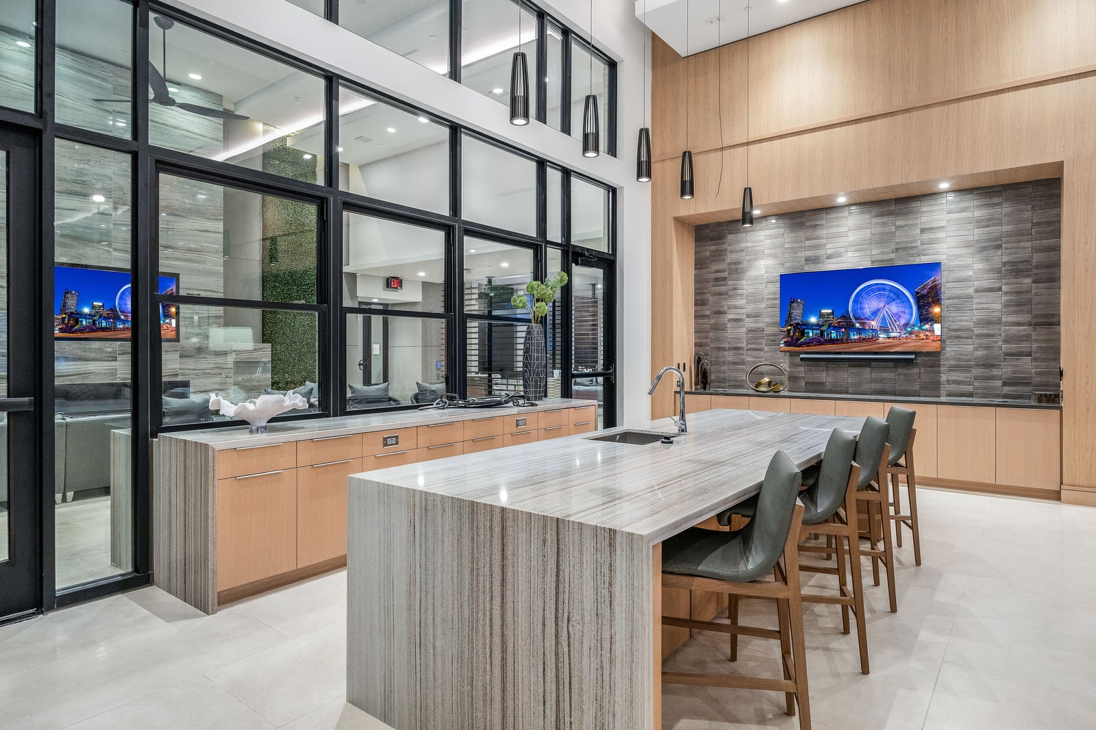 Edgewood club kitchen with waterfall island and glass partition