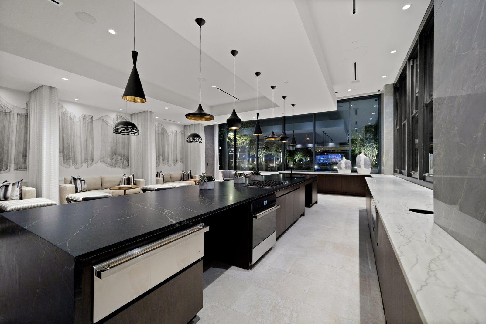 Midtown club room catering kitchen with black stone island
