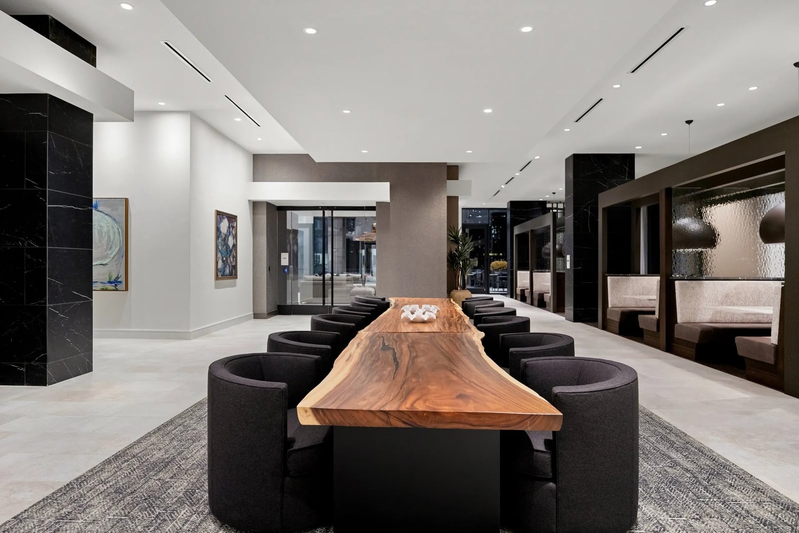 Midtown coworking lounge with live-edge table and booths