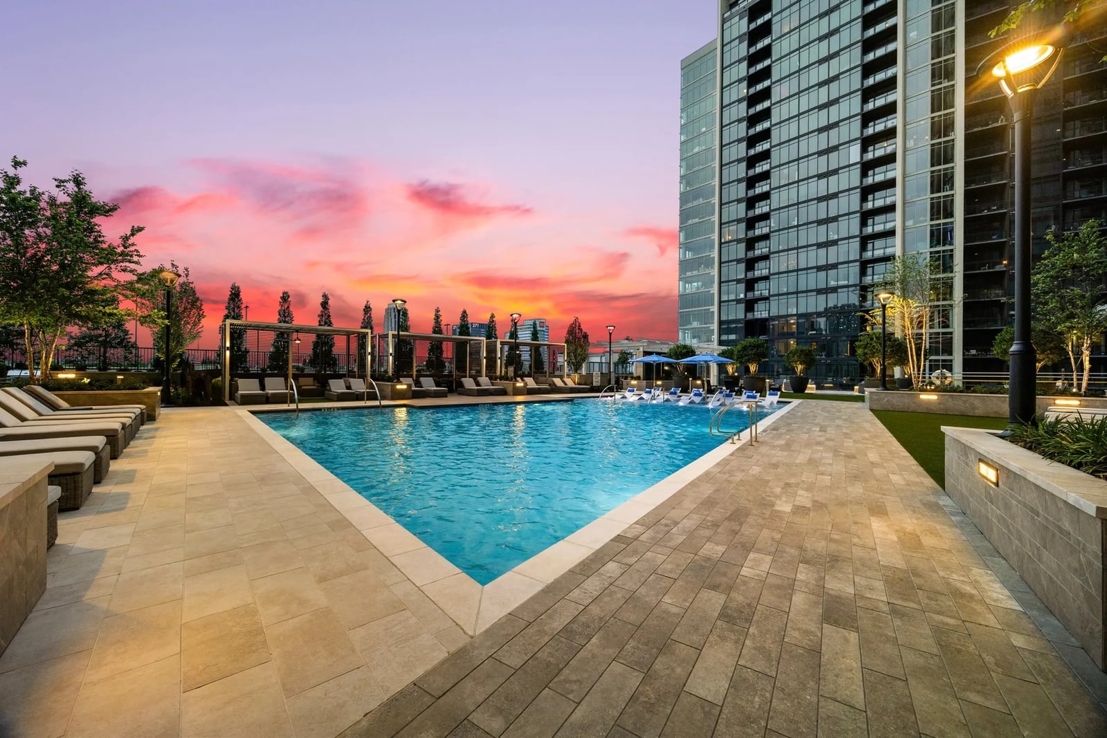 Midtown high-rise apartment tower seen from the pool deck at sunset, Atlanta, GA