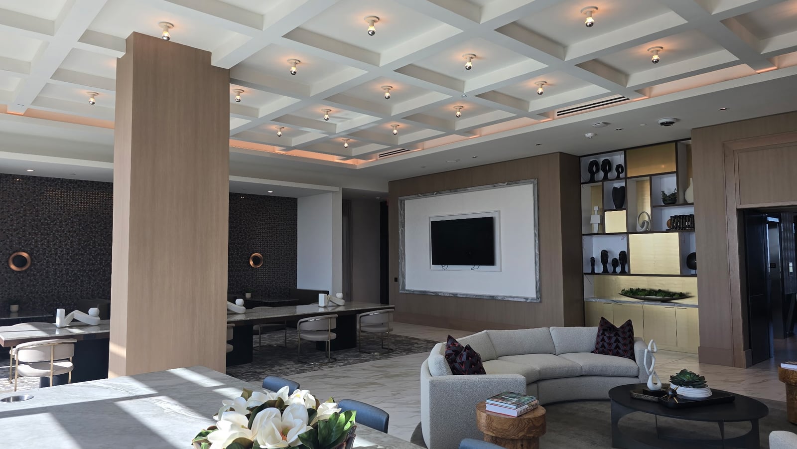 Preston Hollow resident clubroom with a coffered ceiling and lounge seating
