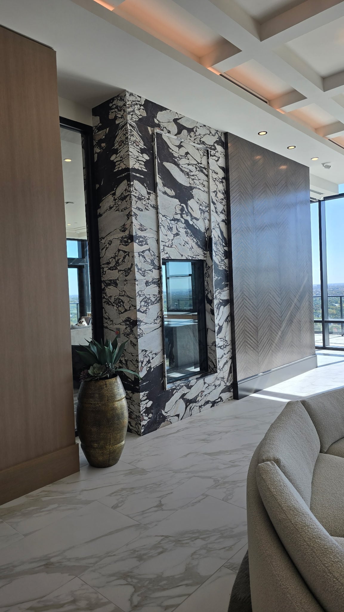 Preston Hollow marble fireplace wall in the resident lounge