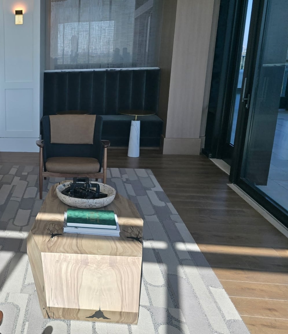 Preston Hollow lounge chair and wood coffee table by the terrace doors