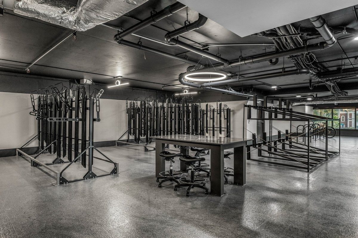 Preston Hollow bike storage room with wall racks and a work table