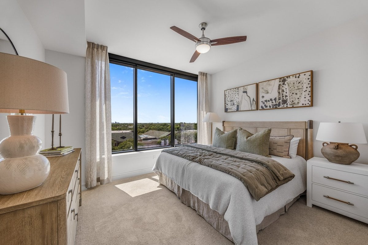 Preston Hollow bedroom with a floor-to-ceiling window