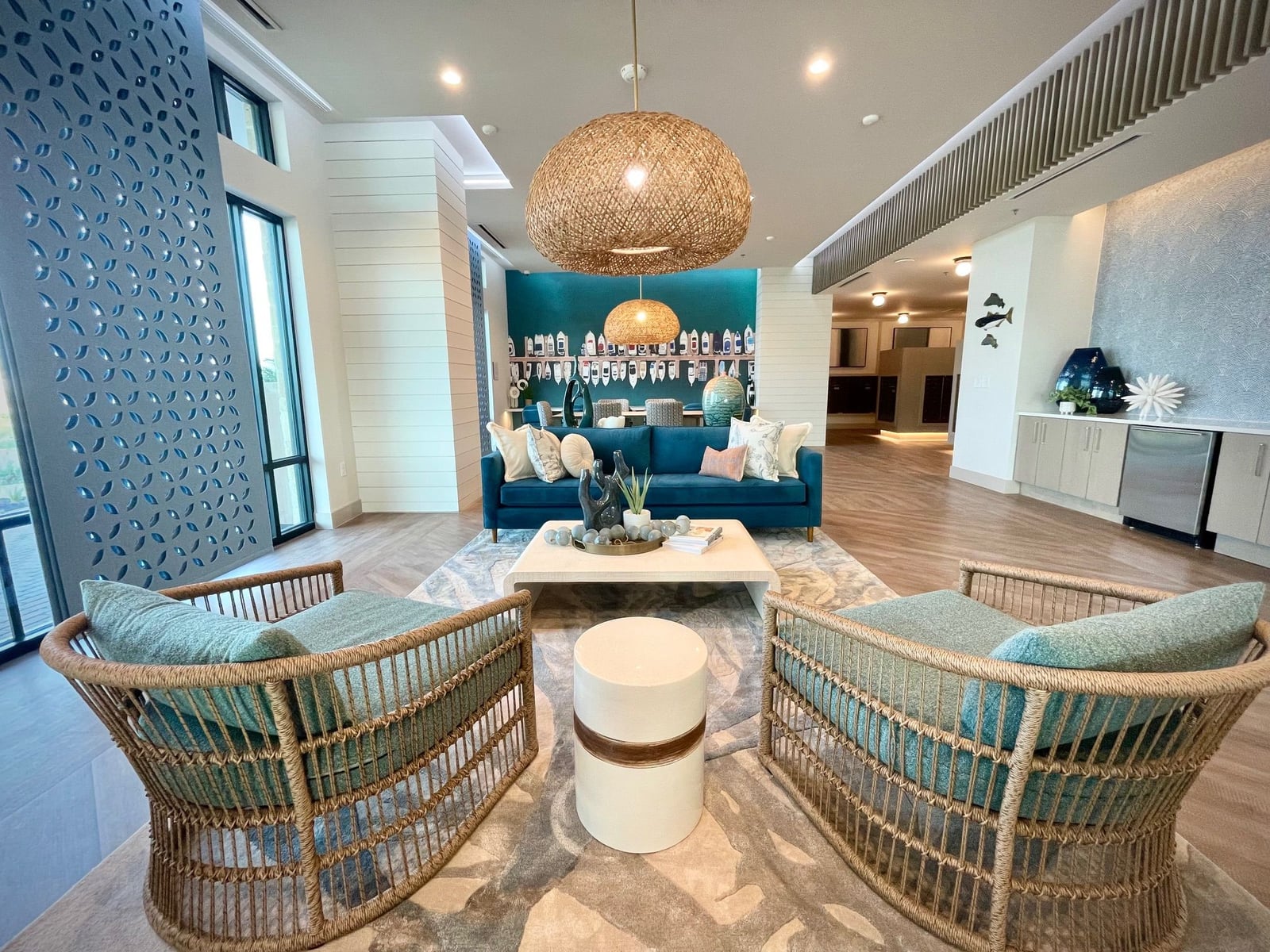 Surfside at Sapphire Bay lobby lounge with wicker seating and shiplap columns