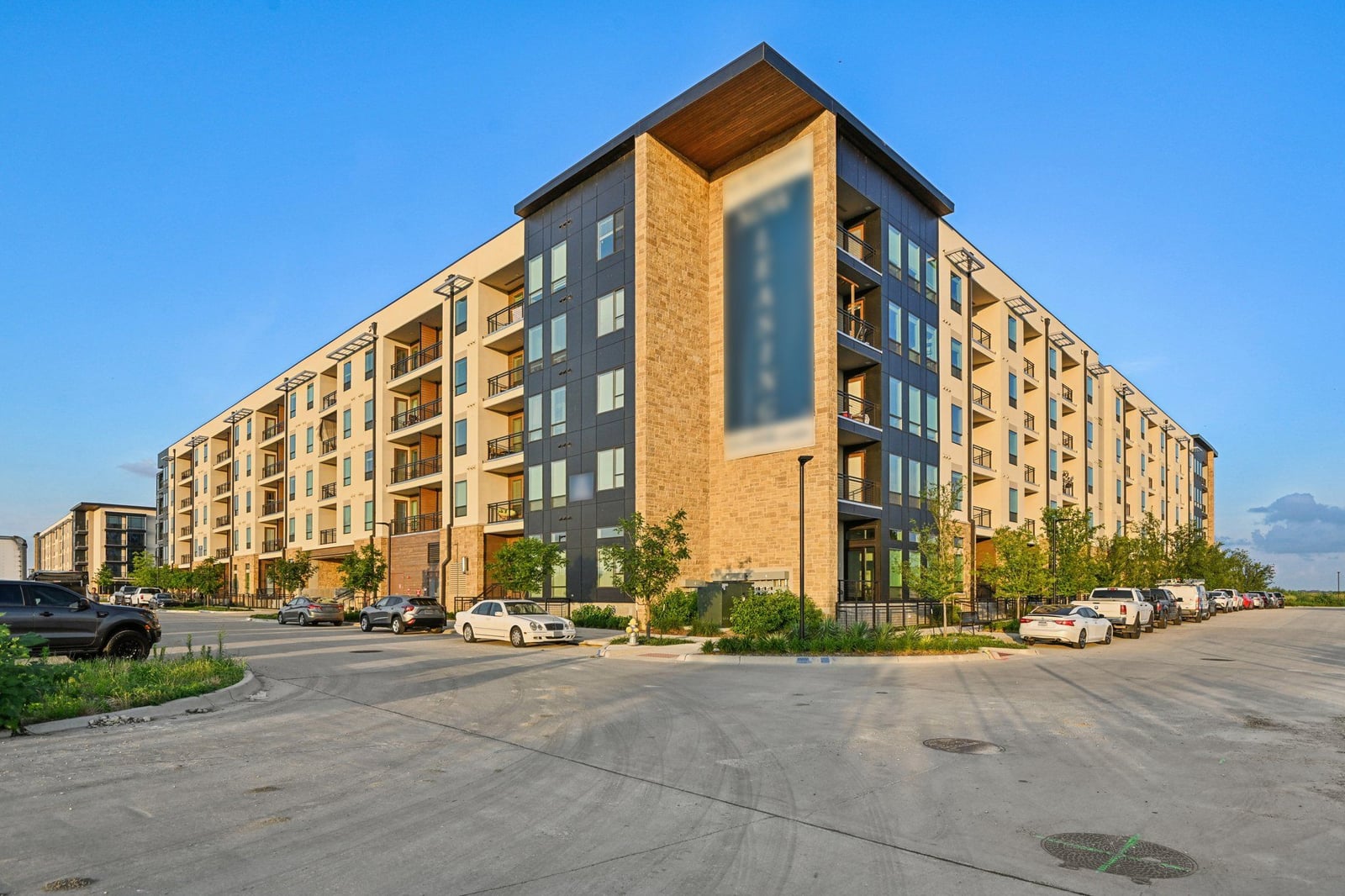 Surfside at Sapphire Bay apartment building corner view at sunset, Rowlett, TX