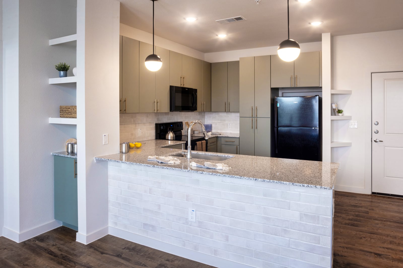 The Rhett kitchen bar with white subway tile and built-in shelving