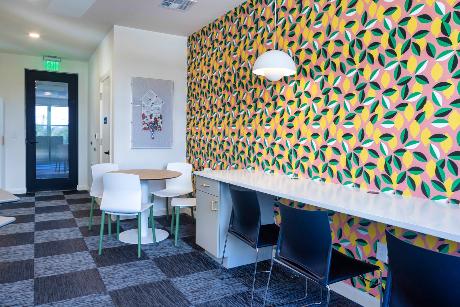 The Rhett activity room with lemon wallpaper and work counter