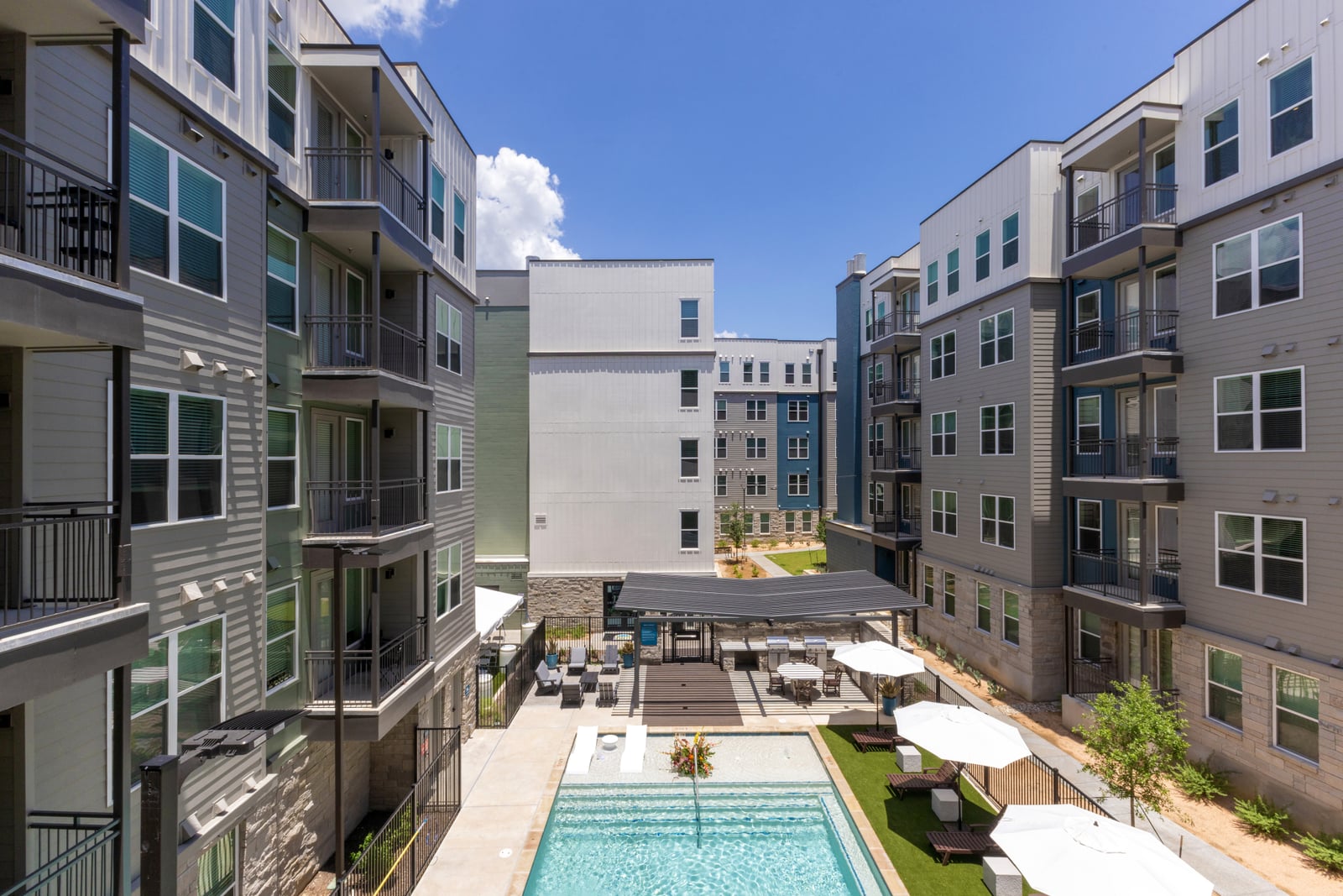 The Rhett courtyard pool between the five-story buildings