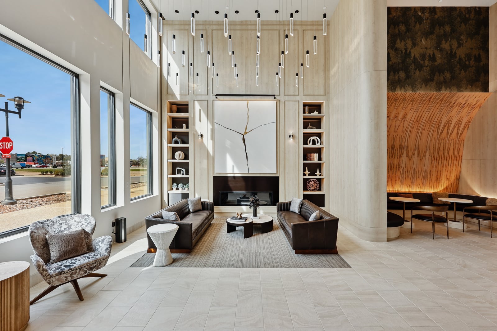 Wellory Living lobby lounge with millwork feature wall and fireplace