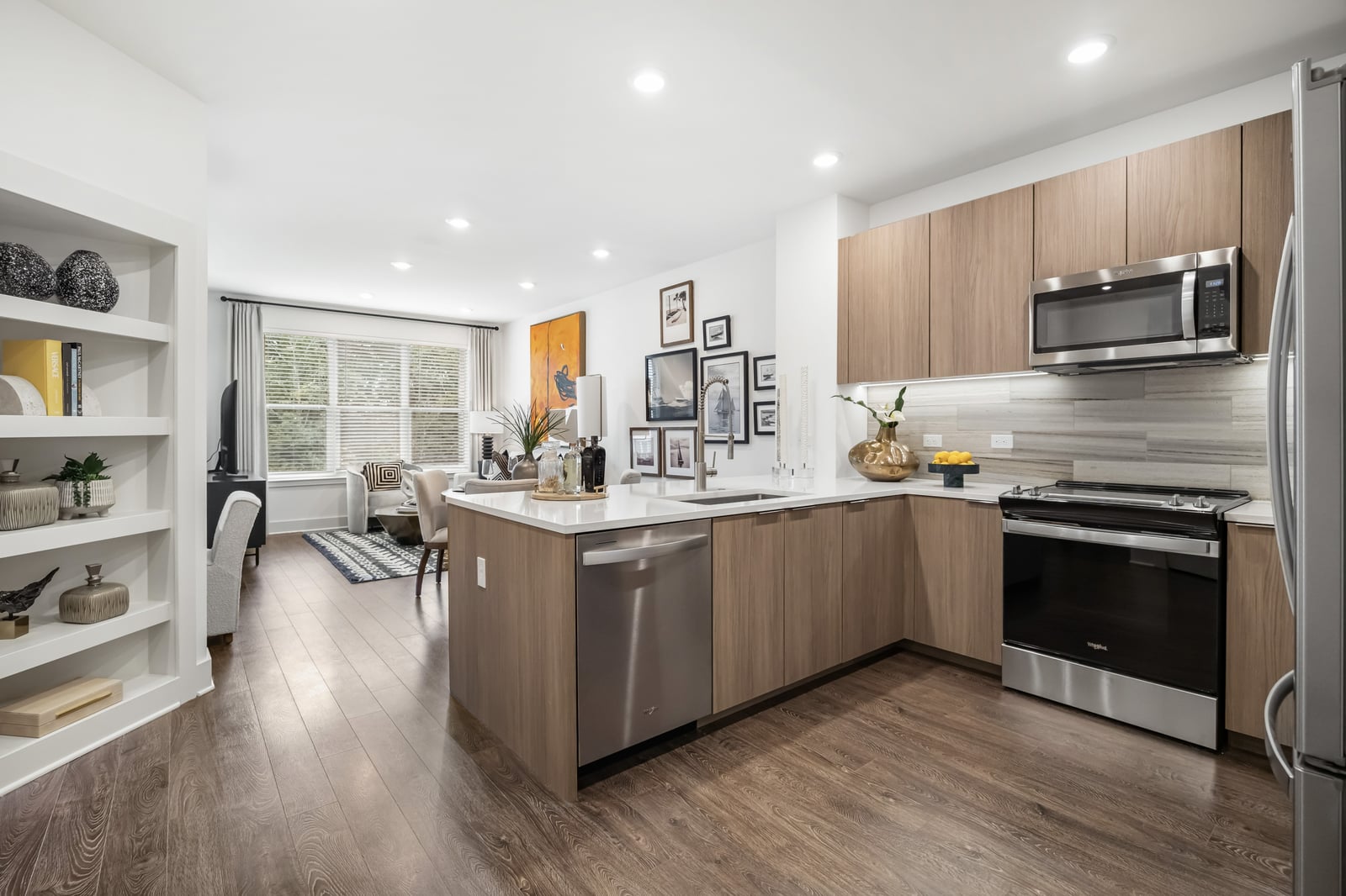 Weymouth kitchen with light wood cabinets, white counters and built-in shelving