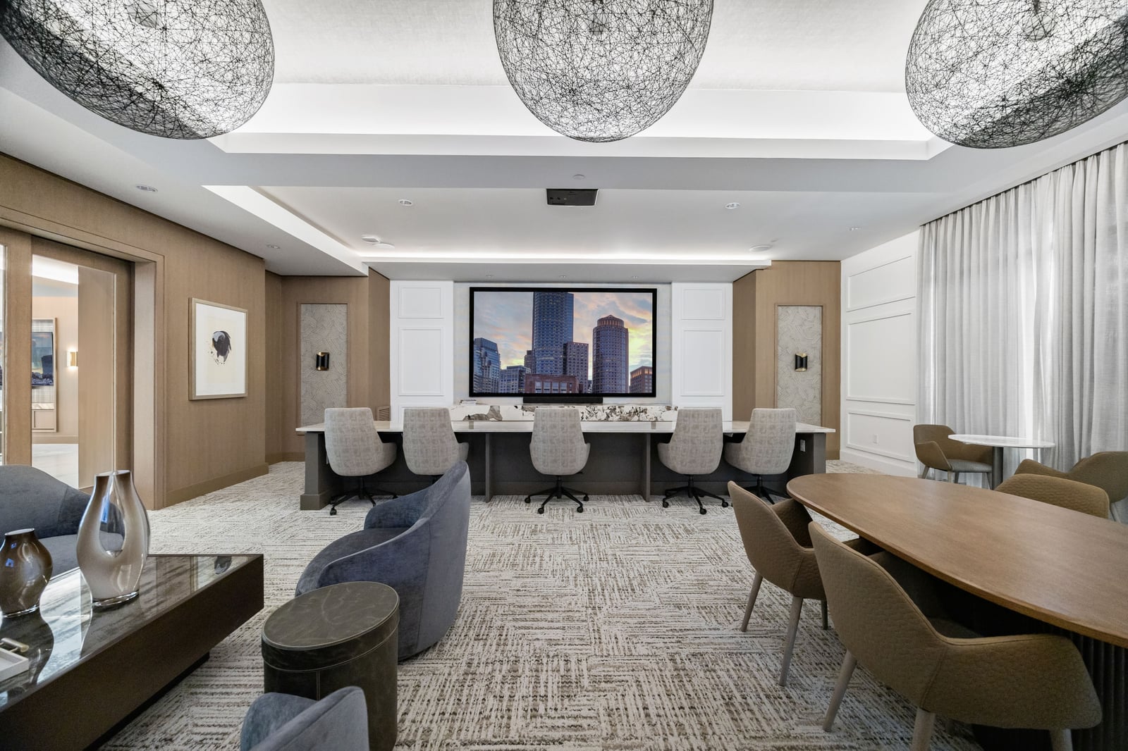 Weymouth media lounge with wall-mounted screen and work table