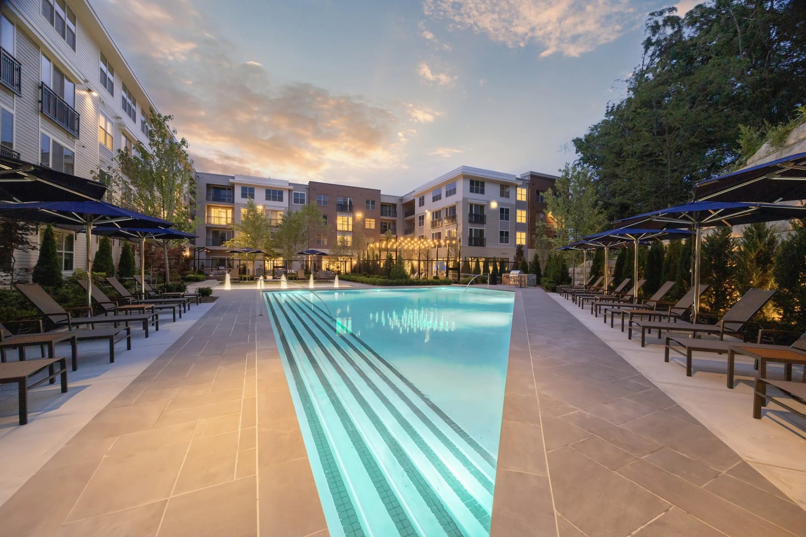 Weymouth apartment community pool courtyard at dusk, Weymouth, MA